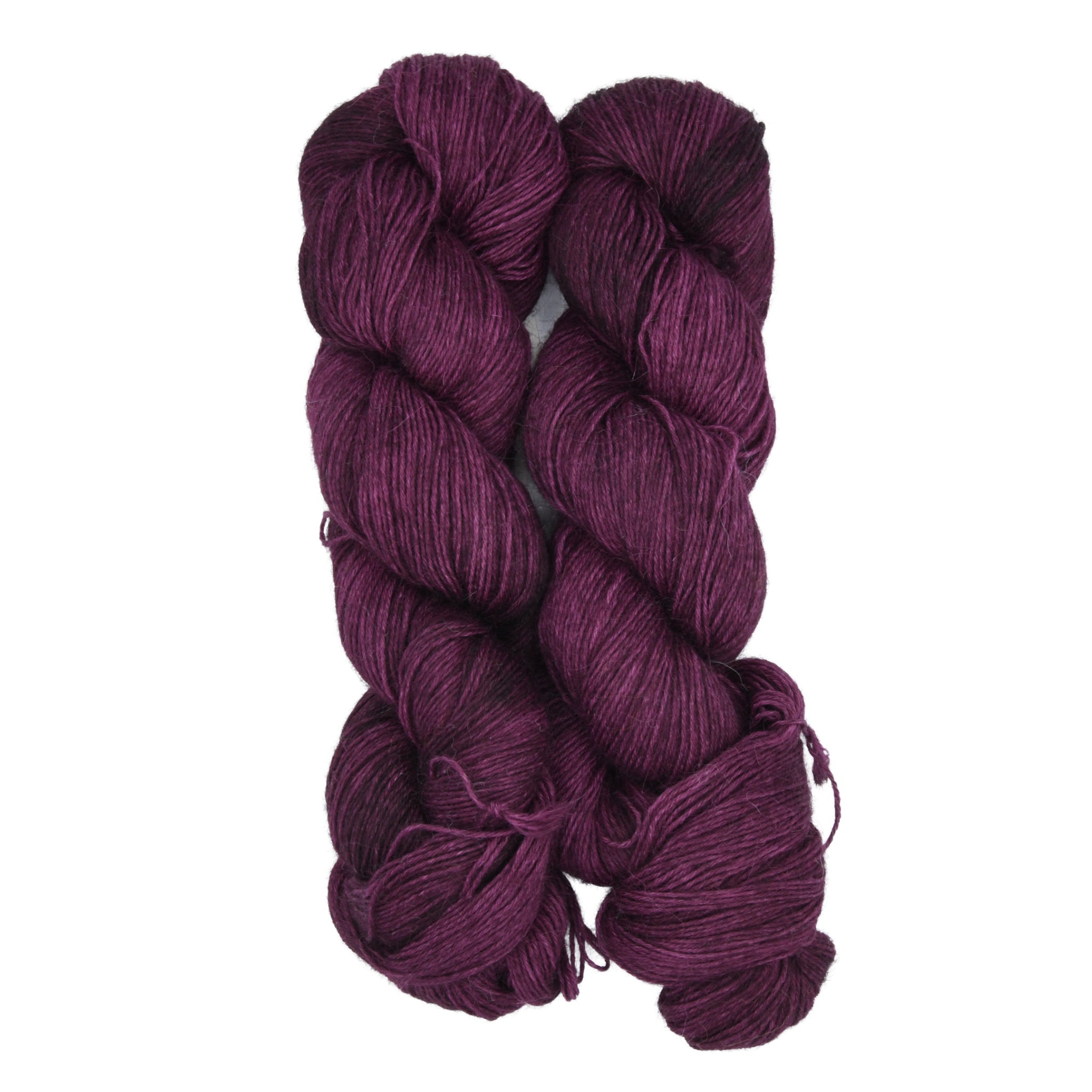 Two skeins of dark purple yarn on a white background