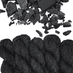 Photo showing yarn and charcoal Woolly Headed Ideas Sport Weight Wool and Hemp Hand Dyed Yarn in Colorway Charcoal