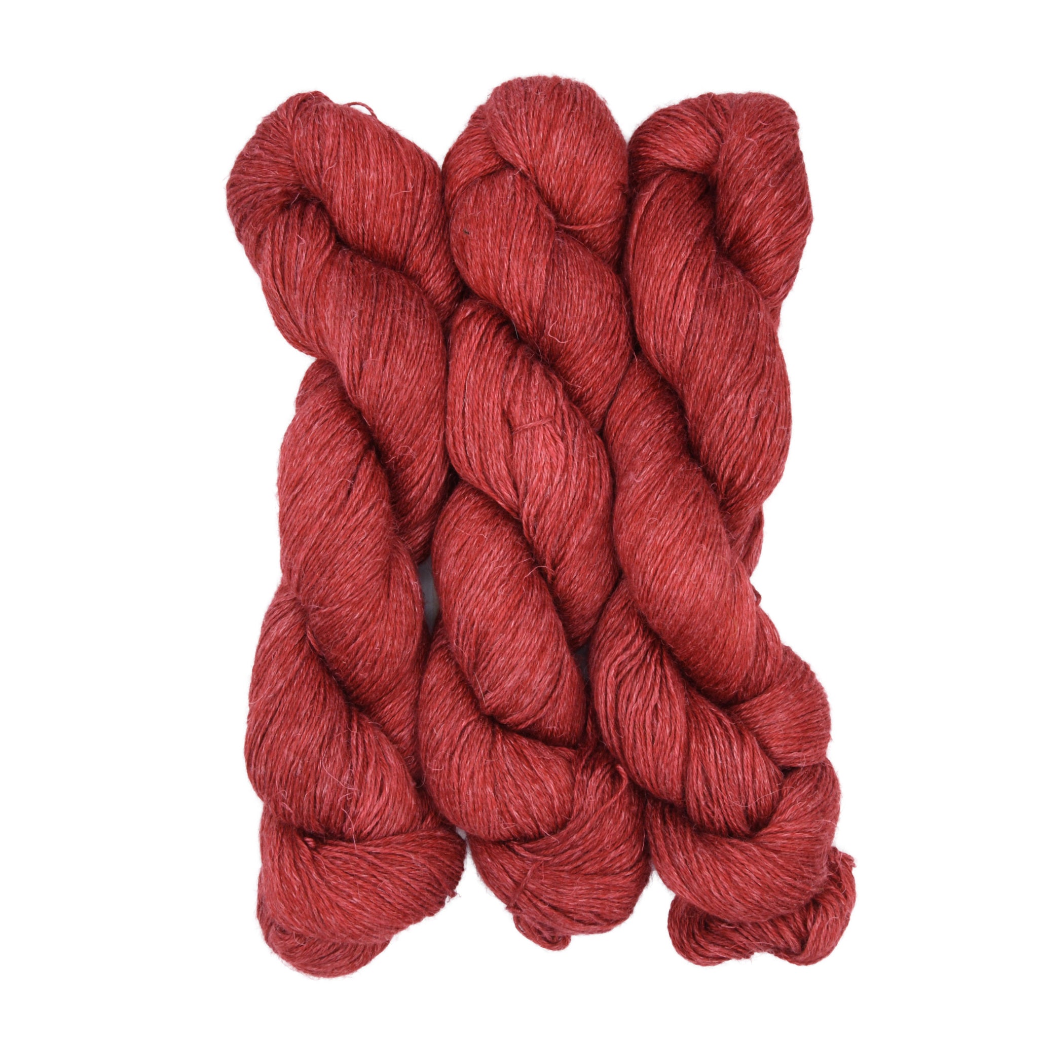 Three skeins of red yarn on a white background