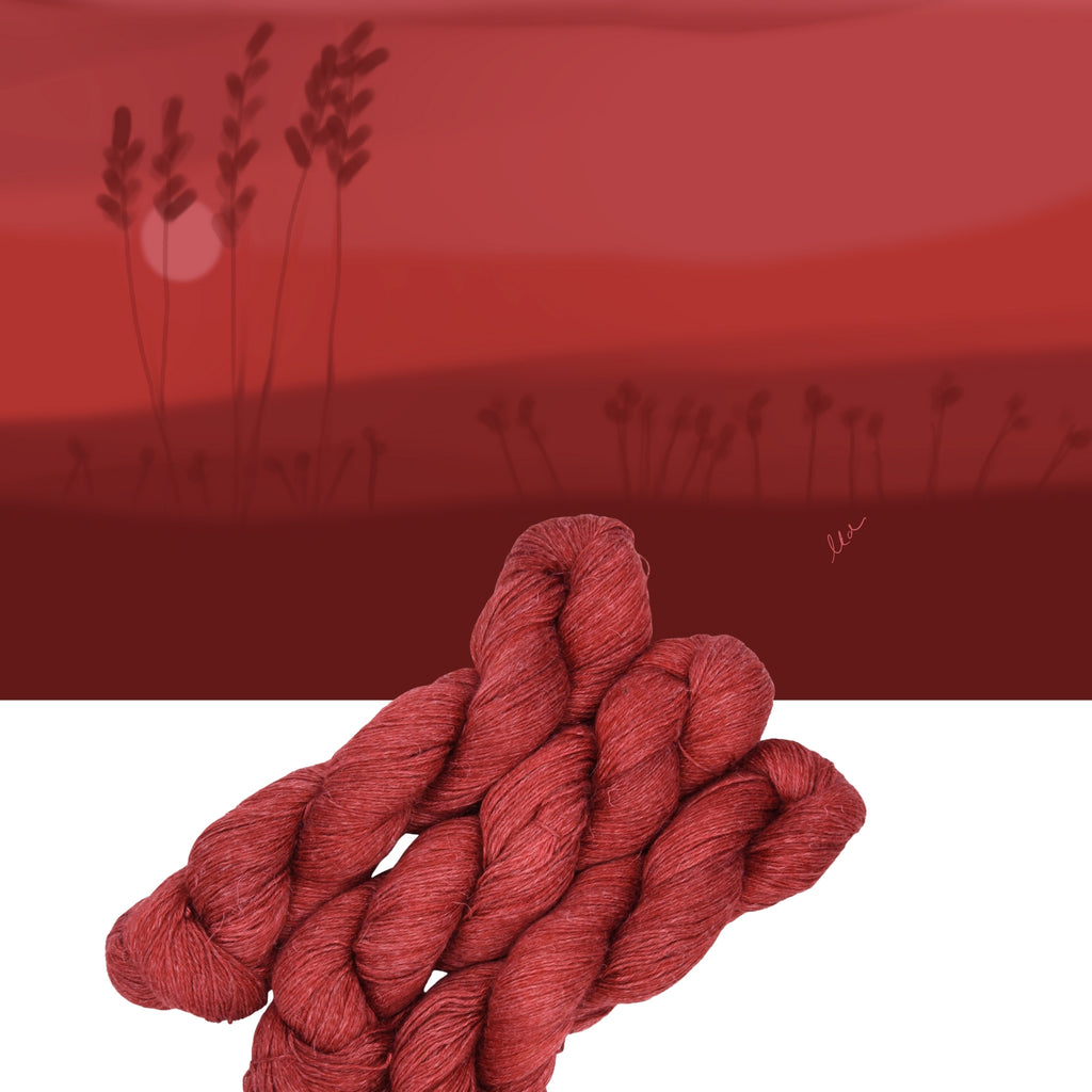 Hand dyed yarn skein in the Cold Today, Hot Tamale colorway featuring bold red tones with warm undertones on a red landscape