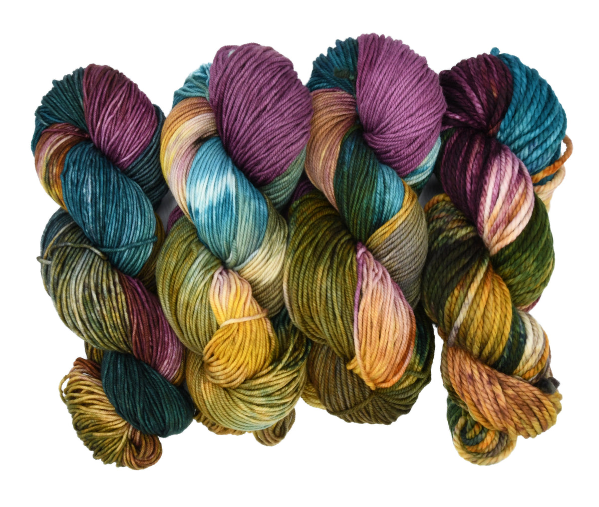 Crown & Cloak hand-dyed yarn by Woolly Headed Ideas in Fingering, DK, Worsted, and Bulky weights, featuring a moody blend of black, dark gray, teal, green, olive, and a splash of gold on a white background