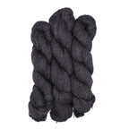 Three skeins of dark brown yarn on a white background