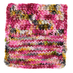 Gordon’s Garden Party hand-dyed showing a knit and crochet sample of the Woolly Headed Ideas colorway that features yellow, red, deep green, maroon, and dark charcoal gray.