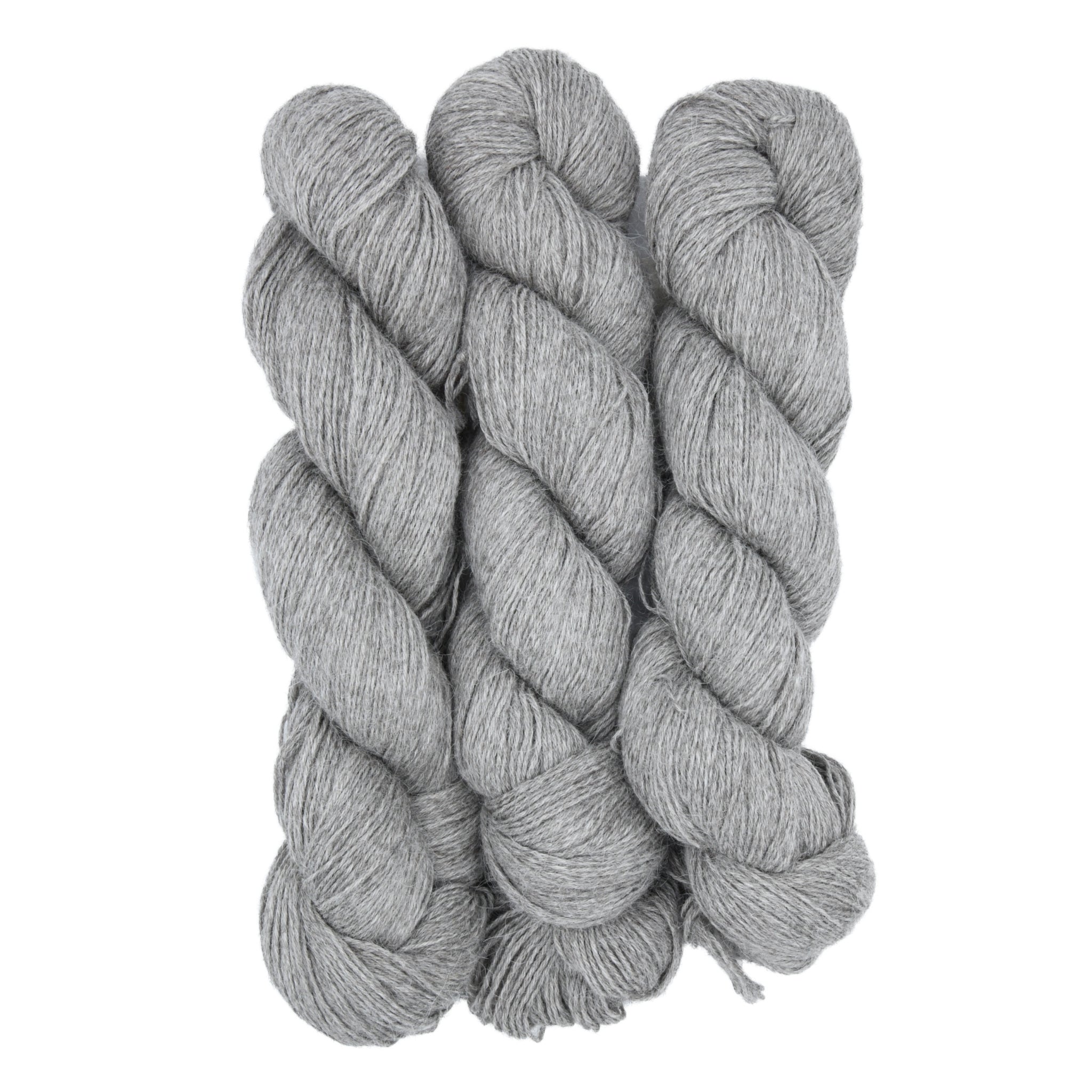 Three skeins of gray yarn twisted together on a white background