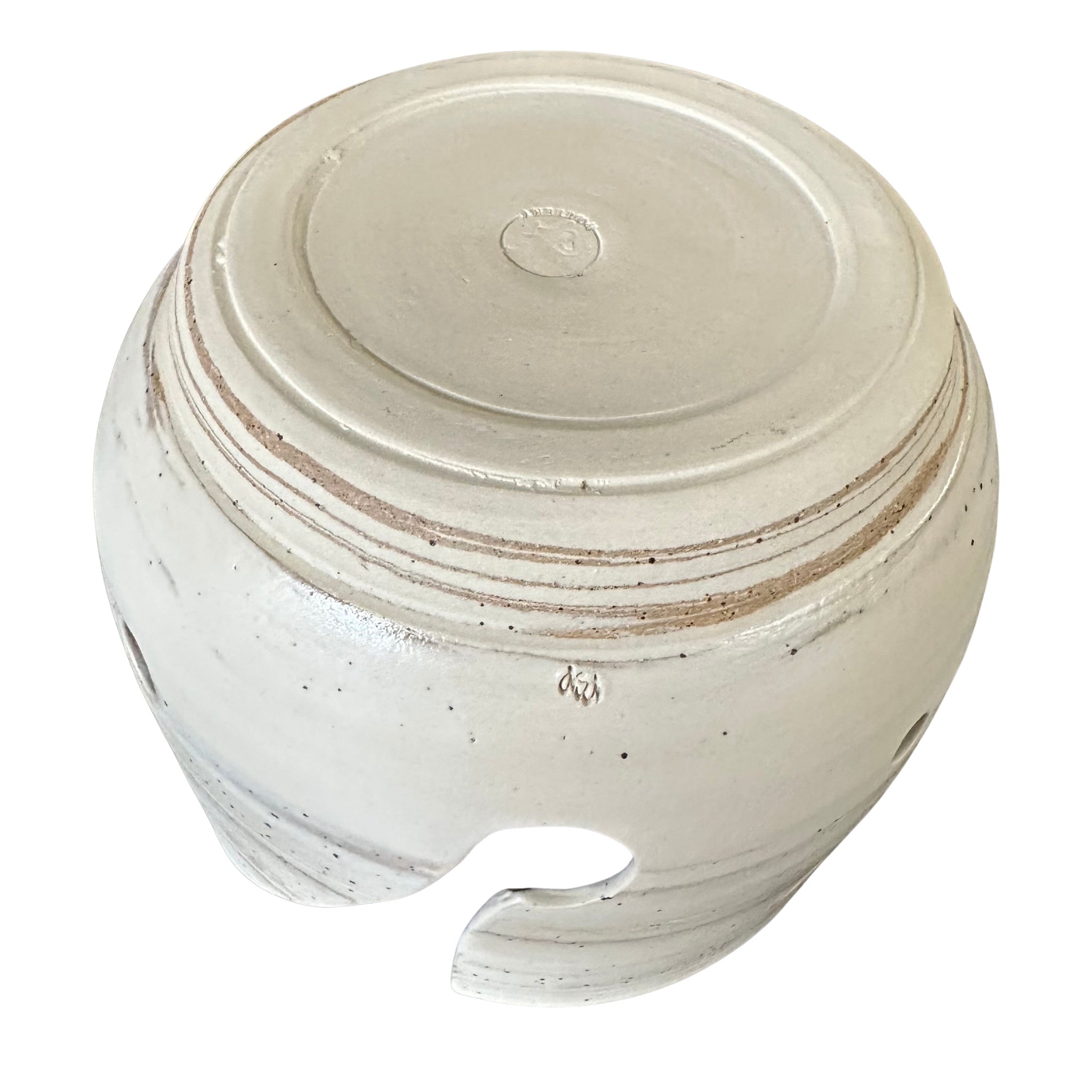 Bottom view of a round ceramic yarn bowl shown on a white background.