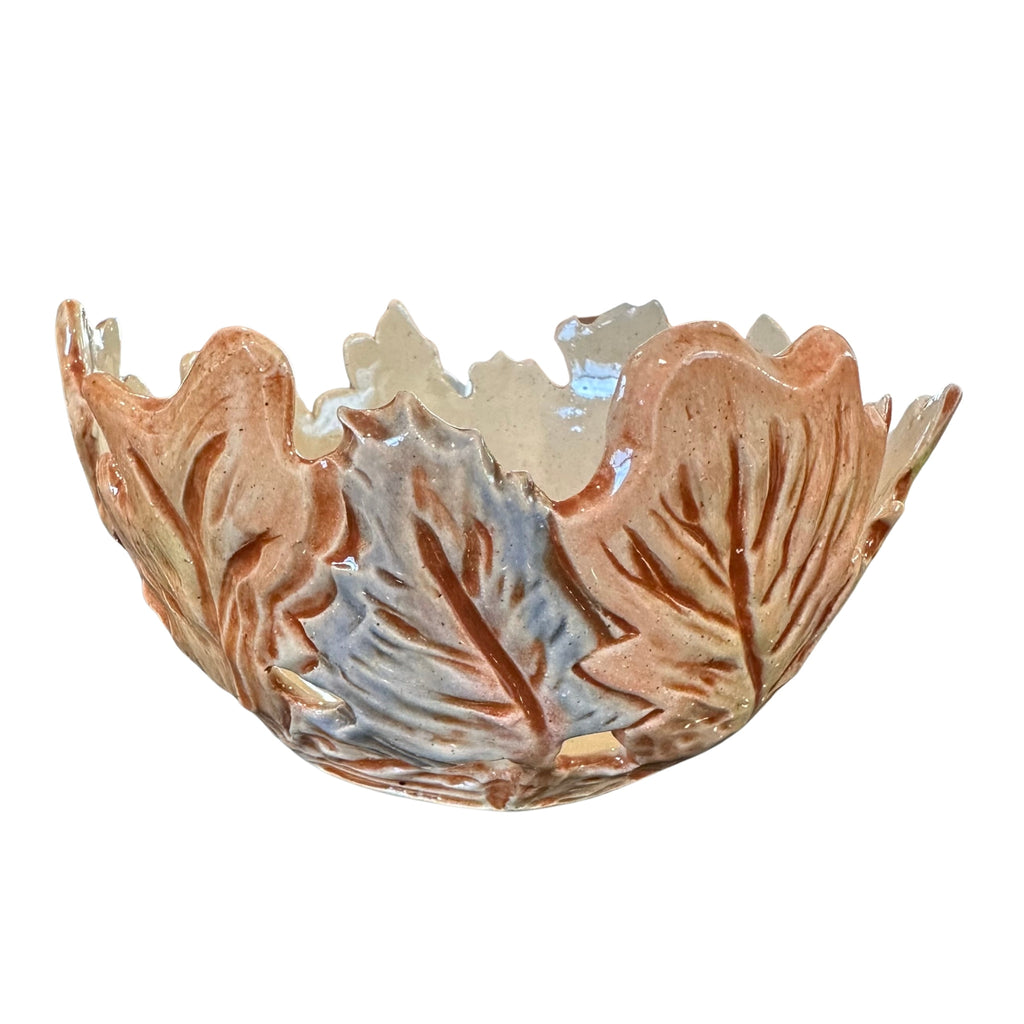 A decorative ceramic bowl with a leaf-like raised pattern, featuring a glossy finish in warm terracotta brown and light blue-gray tones, isolated on a white background.