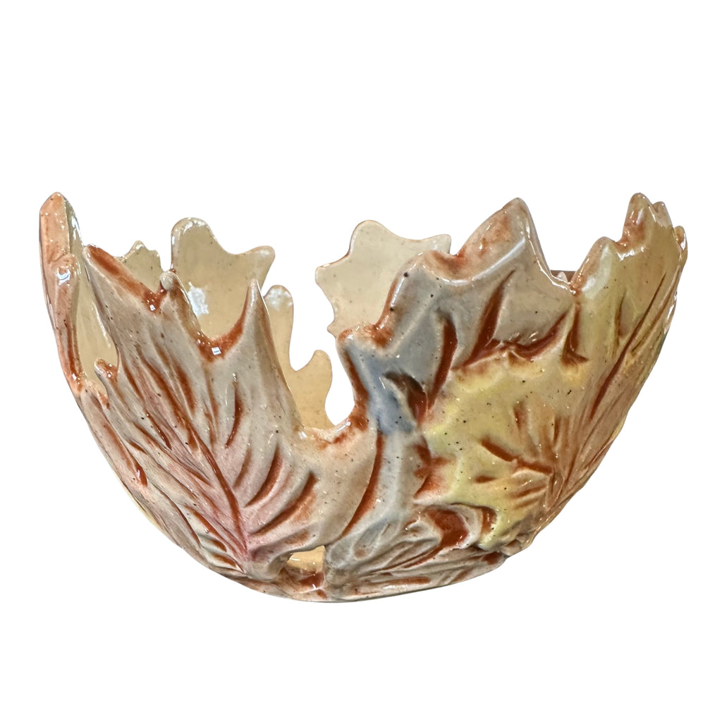 A decorative ceramic bowl with a leaf embossed pattern, featuring a glossy finish in shades of beige, brown, and muted blue-gray, isolated on a white background.