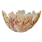 A decorative ceramic bowl with a leaf-like, scalloped rim and raised leaf textures, shown on a plain white background.