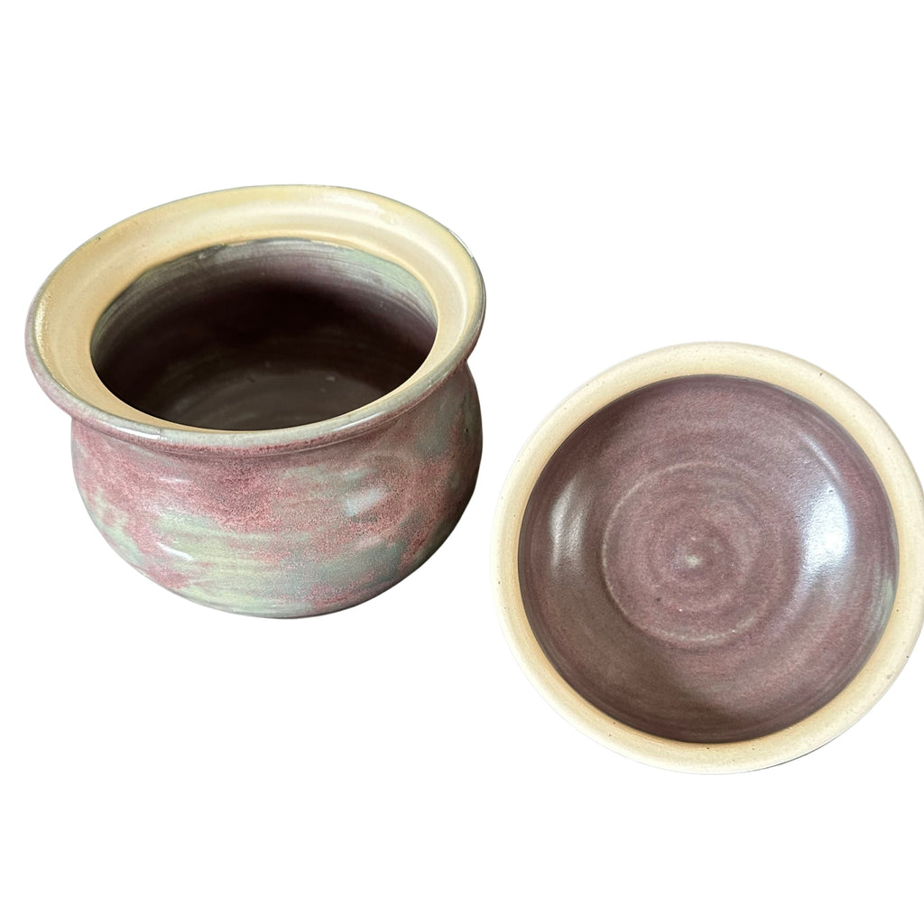 Purple ceramic jar with lid open